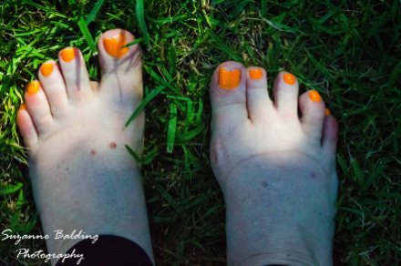 Cool green grass under the toes feels magical on a hot afternoon.